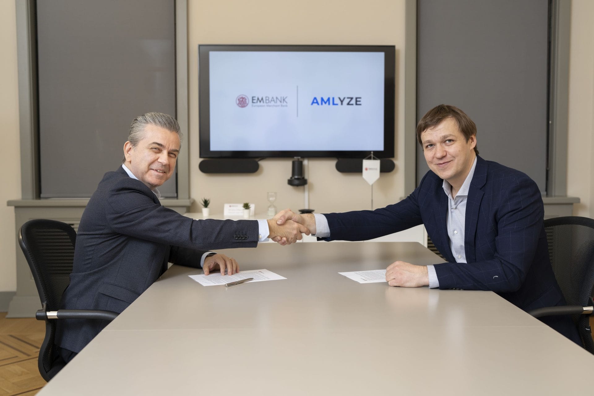 Sarp Demiray, CEO of European Merchant Bank (left), and Gabrielius Erikas Bilkštys, CEO and Co-Founder at AMLYZE